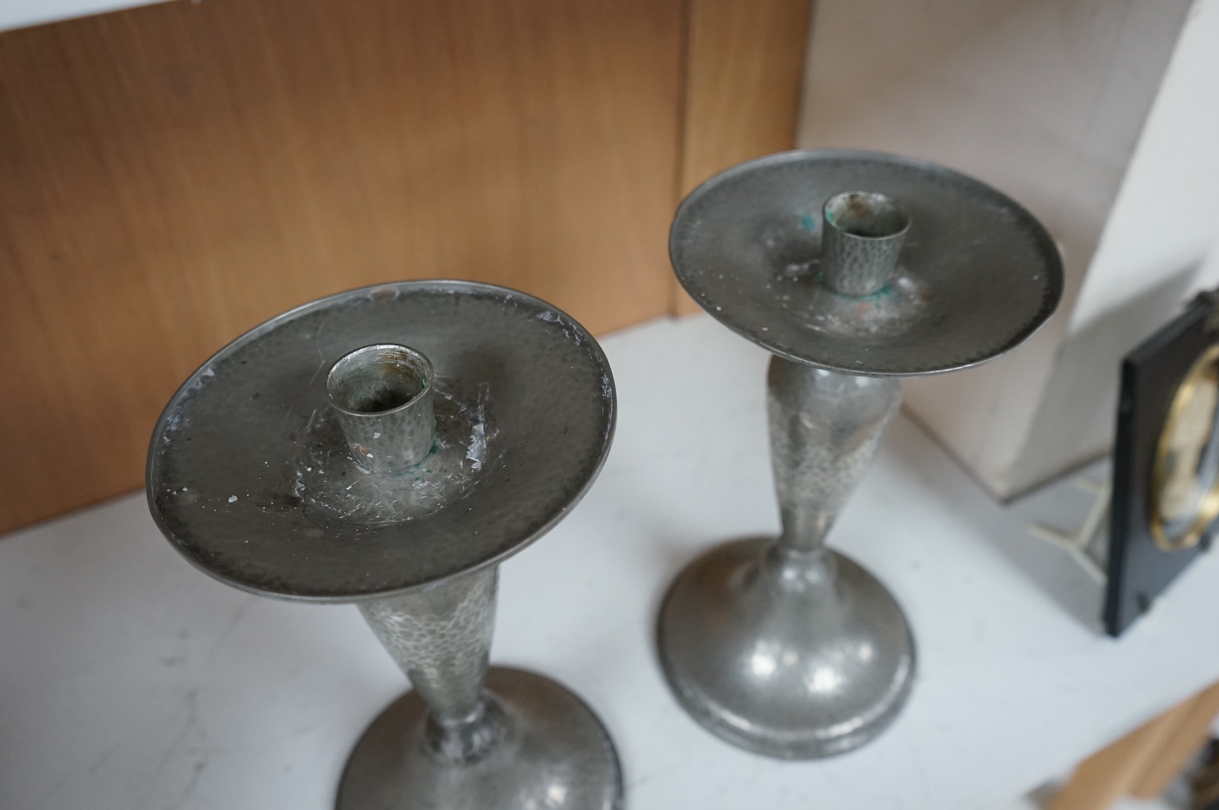 A pair of Liberty Tudric pewter candlesticks, numbered 01223 to the bases, 24cm high